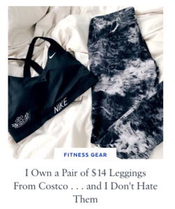 Black marbled leggings and a Nike sports bra laying flat on a bed